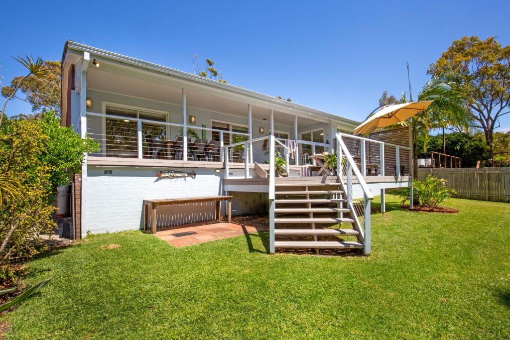 a house with a staircase leading up to it at Nelson's Landing - Pet Friendly in Jervis Bay in Vincentia