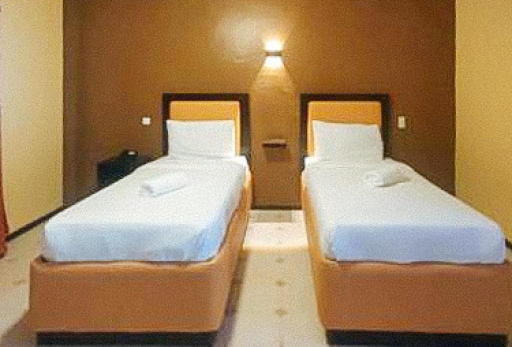 Postel nebo postele na pokoji v ubytování RedDoorz at Carlton-Martin Hotel Masbate City
