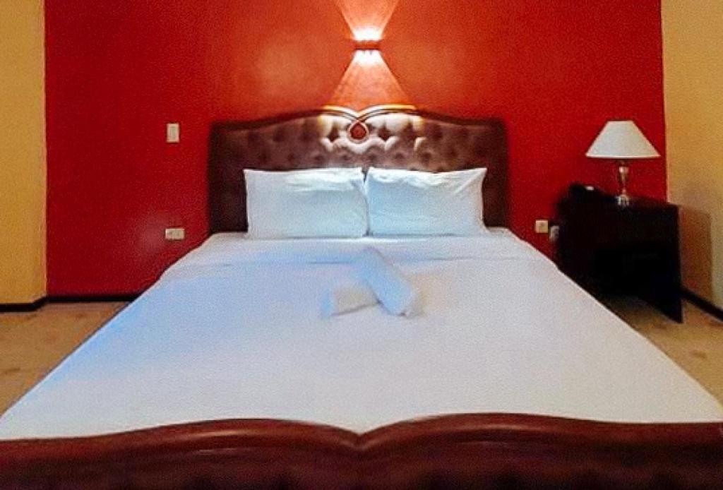 Postel nebo postele na pokoji v ubytování RedDoorz at Carlton-Martin Hotel Masbate City