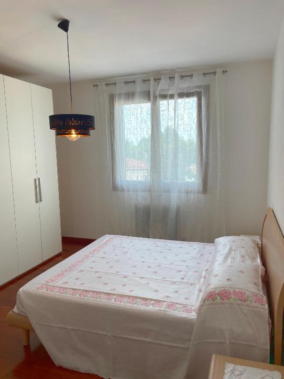 Postel nebo postele na pokoji v ubytování Appartamento Diana