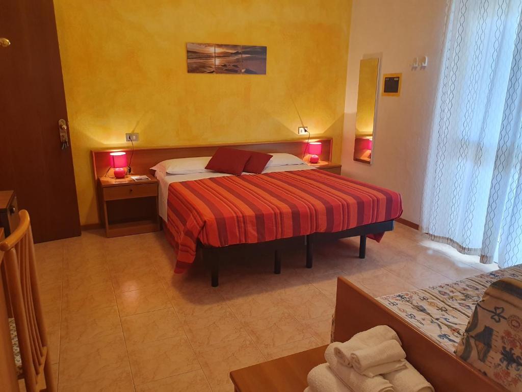 Postel nebo postele na pokoji v ubytování Hotel Nuova Graziosa