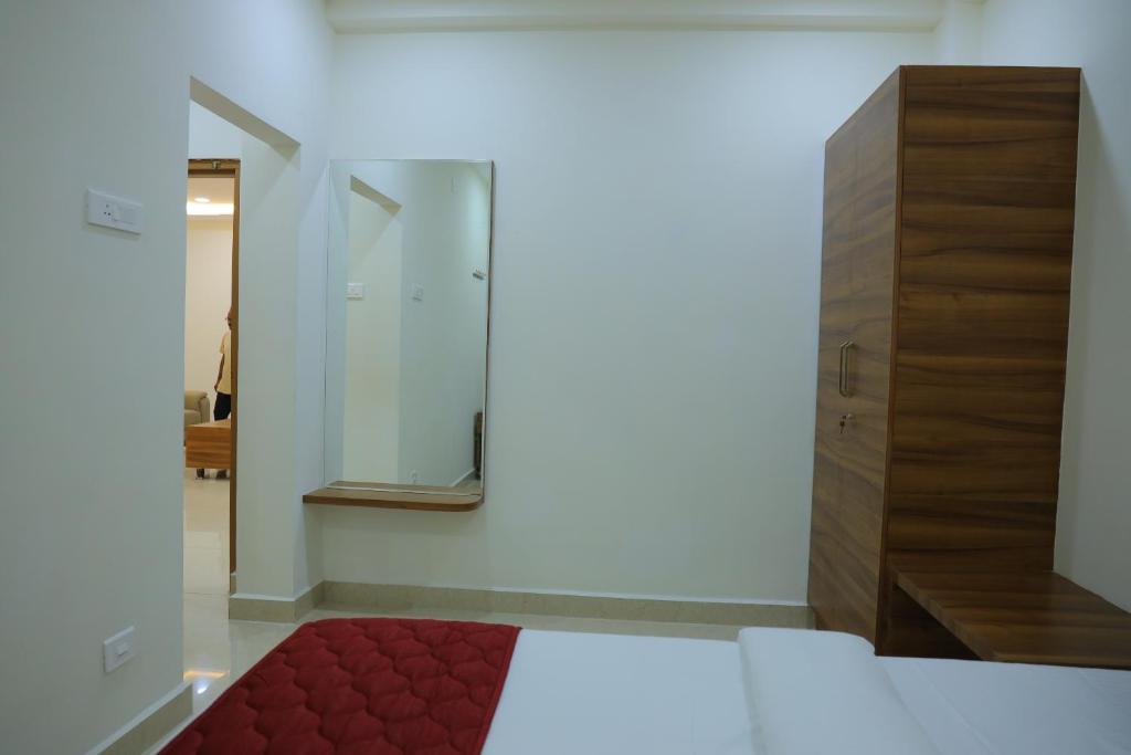 Postel nebo postele na pokoji v ubytování Padma Homes Stay- Luxury Service Apartment 1BHK & 2BHK & 3BHK