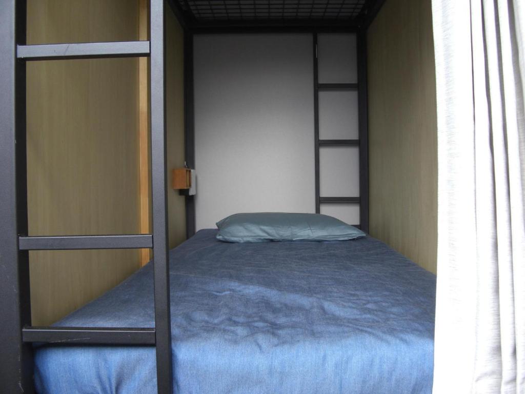 Postel nebo postele na pokoji v ubytování 令和院 Leiwa Inn