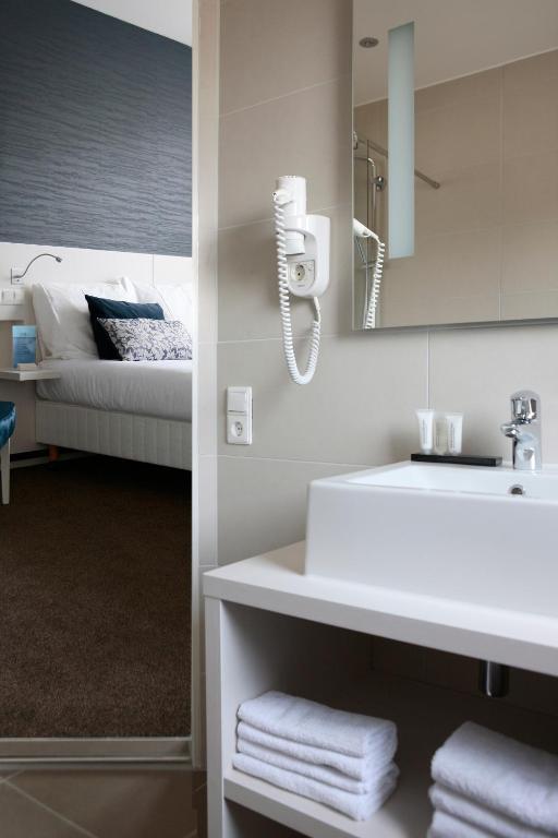 Postel nebo postele na pokoji v ubytování Hotel Zeerust Texel