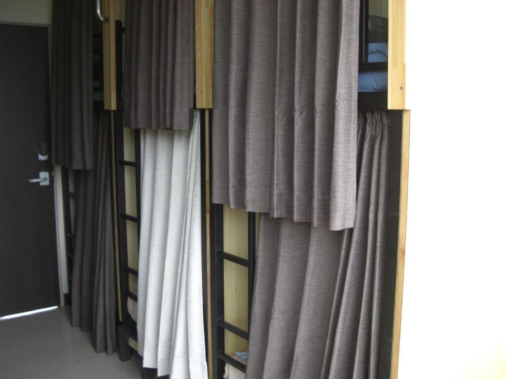 a row of curtains in a room at 令和院 Leiwa Inn in Tottori