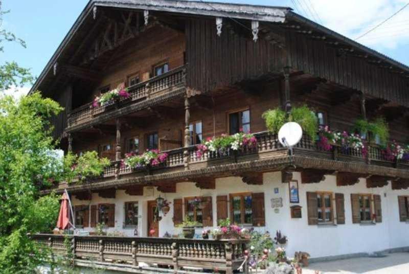 a building with flowers on the balconies of it at Braun Hof in Fischbachau