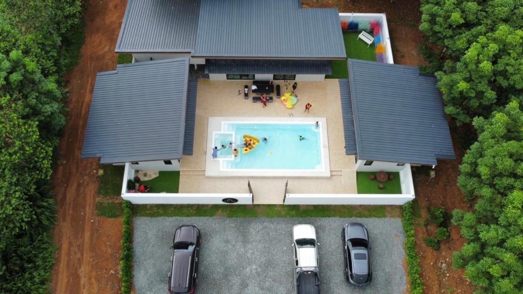 an aerial view of a house with a swimming pool at Pool Villa at Salak 