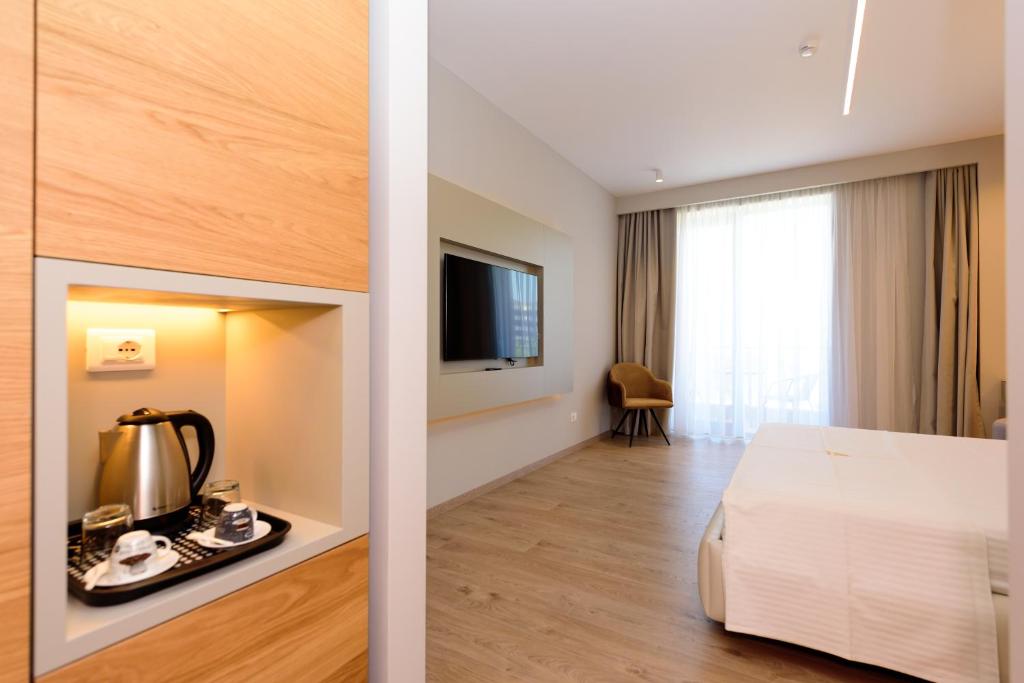 Postel nebo postele na pokoji v ubytování Navy Hotel