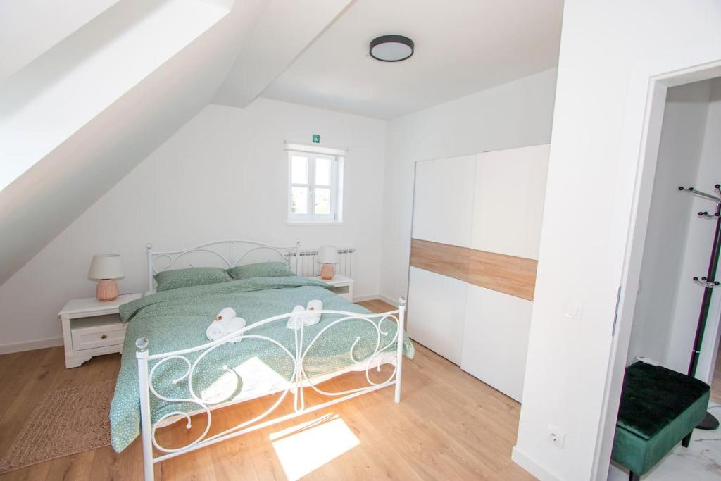Postel nebo postele na pokoji v ubytování Apartmani Kac