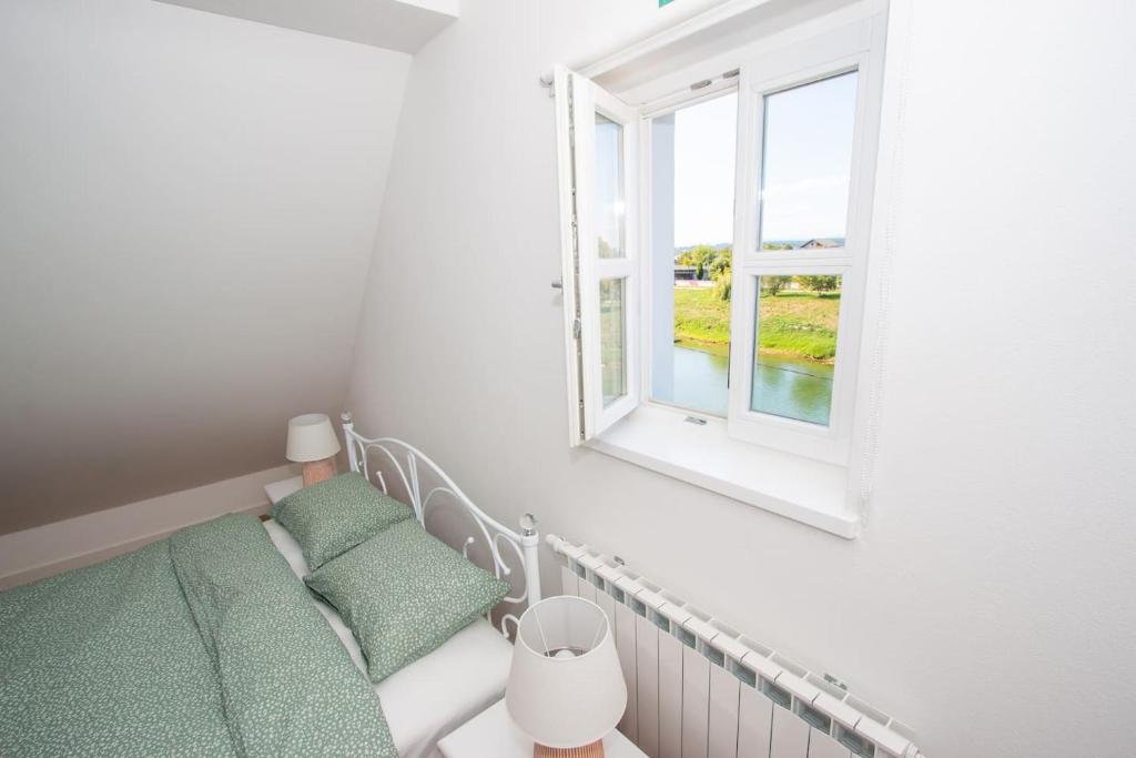 Postel nebo postele na pokoji v ubytování Apartmani Kac