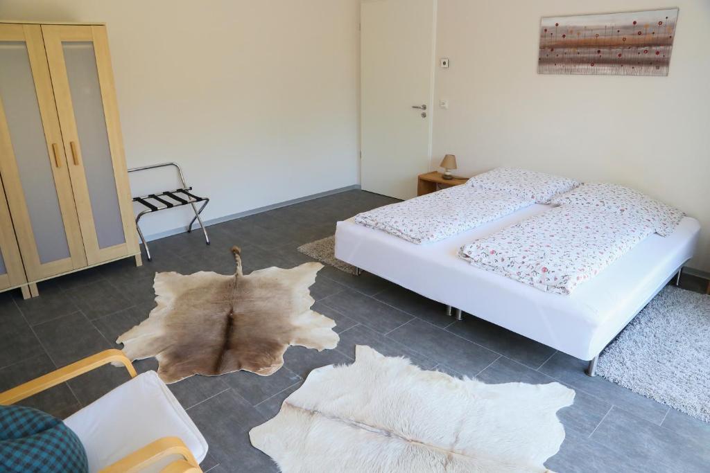 Postel nebo postele na pokoji v ubytování Plantagengut Hosterwitz