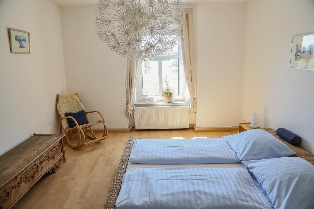 Postel nebo postele na pokoji v ubytování Plantagengut Hosterwitz