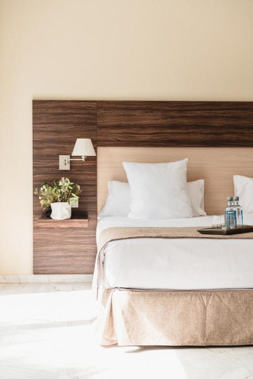 A bed or beds in a room at Hotel Finca Los Abetos