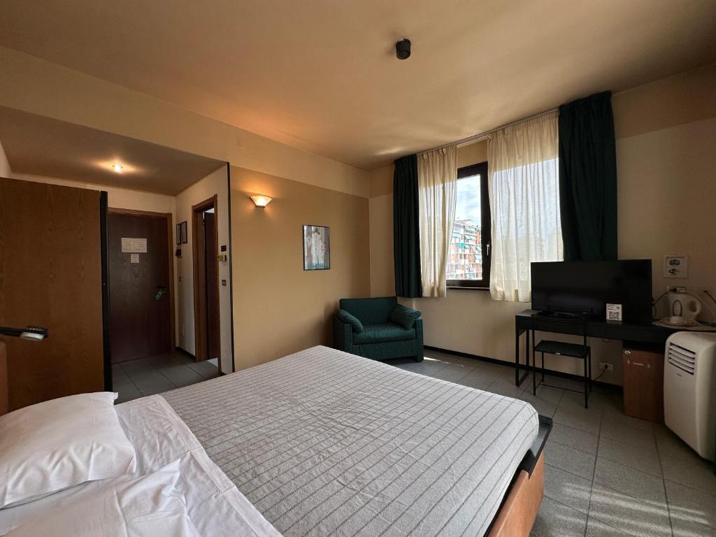 Posteľ alebo postele v izbe v ubytovaní Hotel Griselda