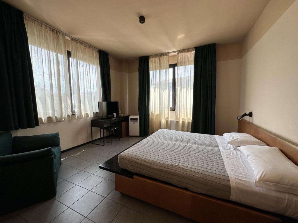 Posteľ alebo postele v izbe v ubytovaní Hotel Griselda
