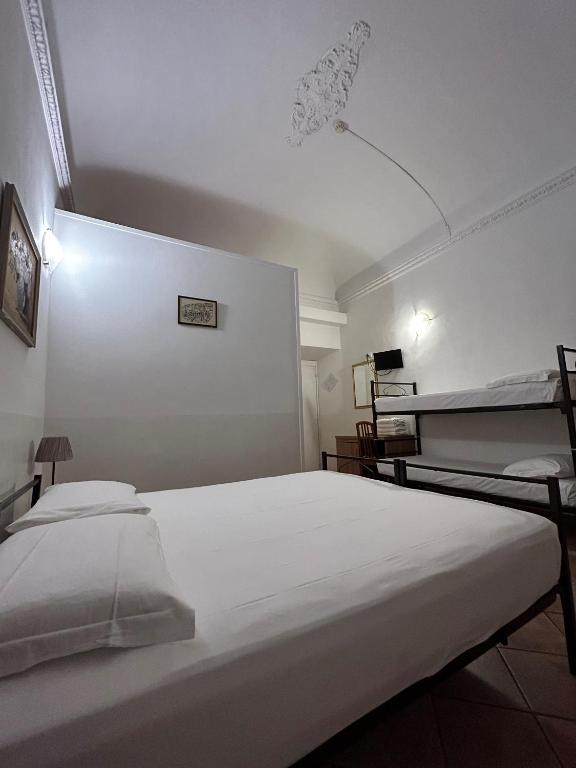 Postel nebo postele na pokoji v ubytování Hotel Il Papavero