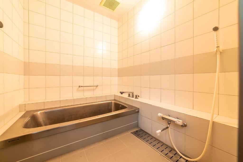 Koupelna v ubytování Ooedo Onsen Monogatari Premium Kinosaki