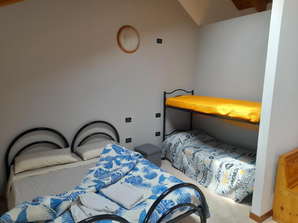 Postel nebo postele na pokoji v ubytování Agriturismo Val di Ferro
