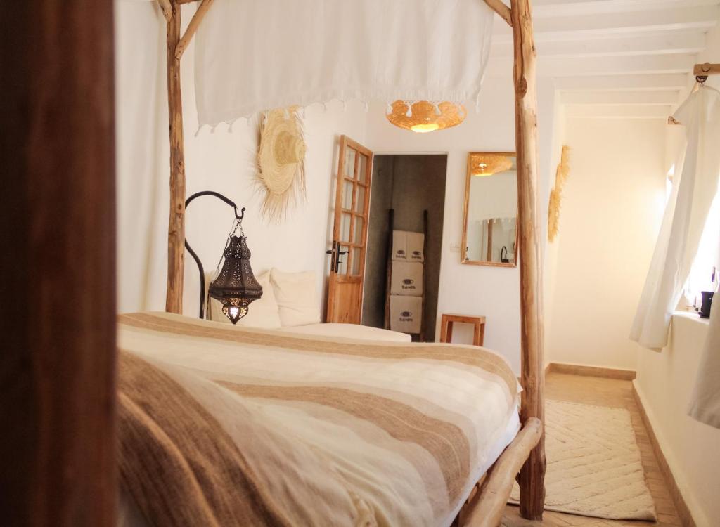 Postel nebo postele na pokoji v ubytování Riad Baladin