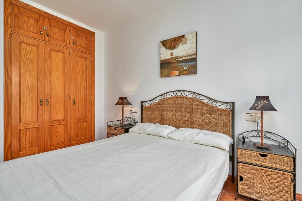 Posteľ alebo postele v izbe v ubytovaní Beachfront apartment Torrox Costa