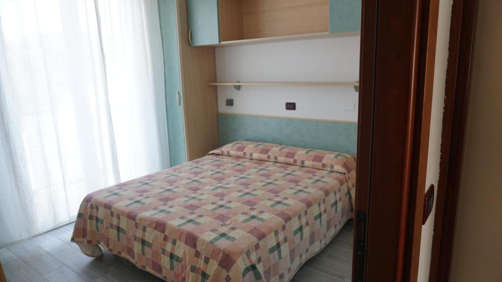 A bed or beds in a room at Residence Renadoro