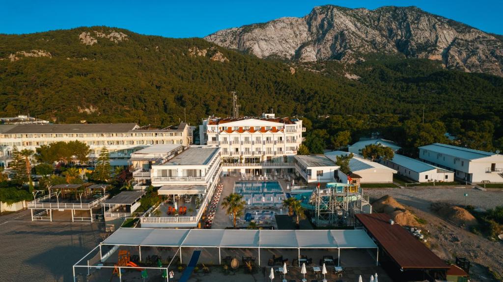 an aerial view of a town with a mountain in the background at SL La Perla Hotel Kemer in Antalya