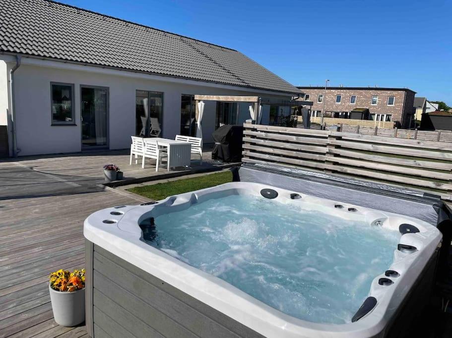 a hot tub on the deck of a house at New luxurious Villa in Helsingborg close to the City in Helsingborg
