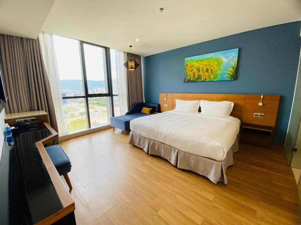 Postel nebo postele na pokoji v ubytování NAM Hotel & Residences