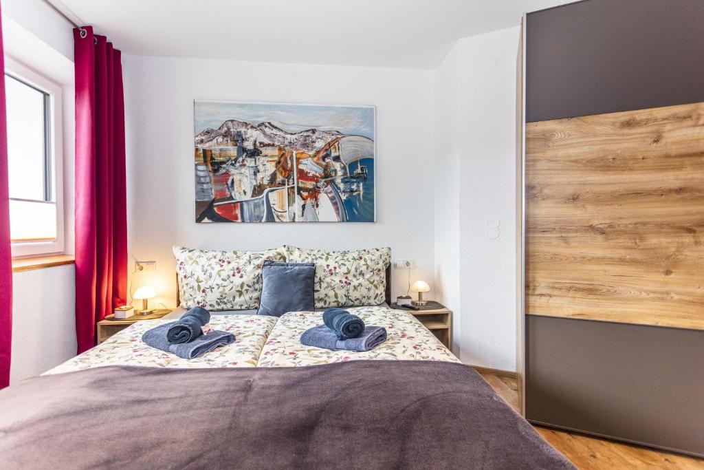 Posteľ alebo postele v izbe v ubytovaní Ferienwohnung Katharina