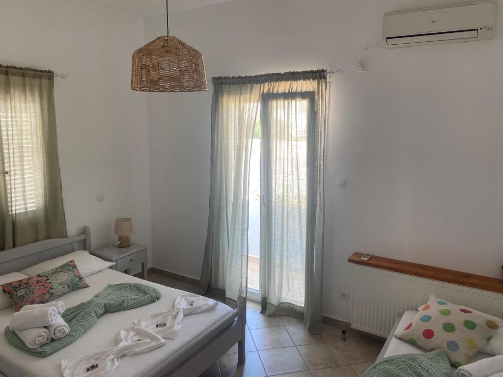 Postel nebo postele na pokoji v ubytování MARGARITA STUDIOS