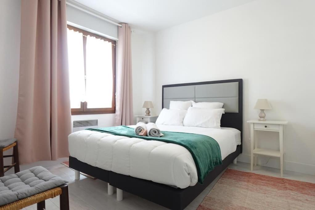 Voodi või voodid majutusasutuse L'Agréable - Appartement toas