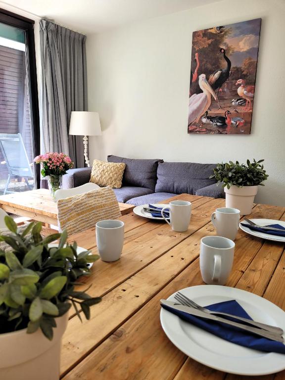 a living room with a table and a couch at Winterberg Appartement 21097 in Winterberg