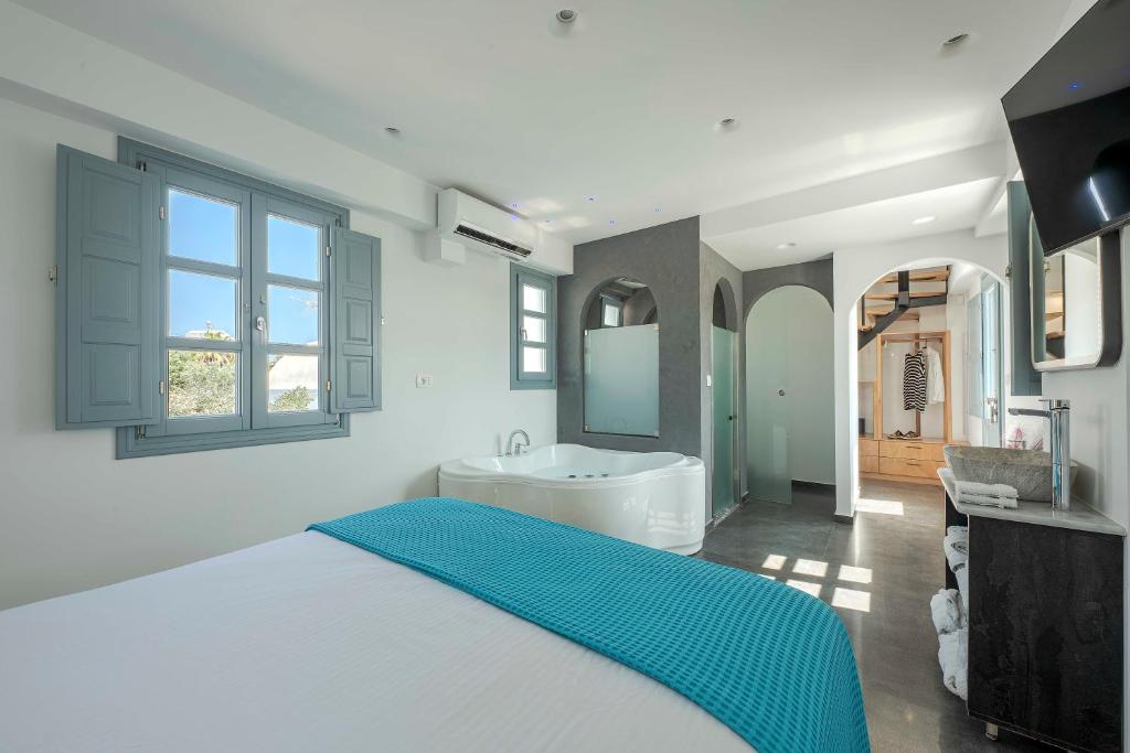 Postel nebo postele na pokoji v ubytování BlackStone Luxury Suites