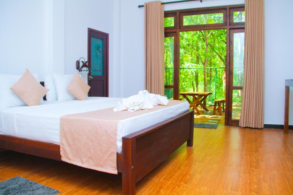 Voodi või voodid majutusasutuse Amare Safari Resort Udawalawe toas