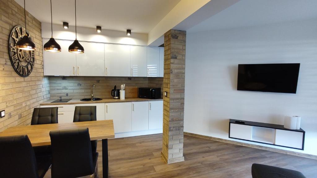 Кухня или мини-кухня в Darłówko Apartament Morski XIII
