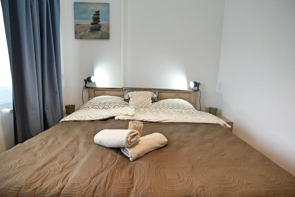 Postel nebo postele na pokoji v ubytování Astoria Lednice