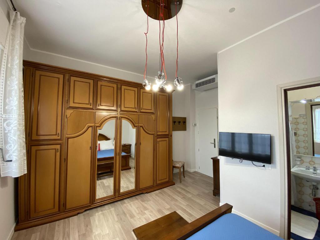TV a/nebo společenská místnost v ubytování Albergo Lodrino