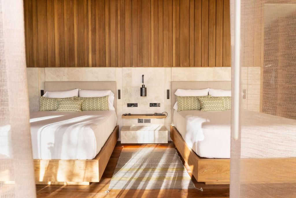 Postel nebo postele na pokoji v ubytování Banyan Tree Mayakoba