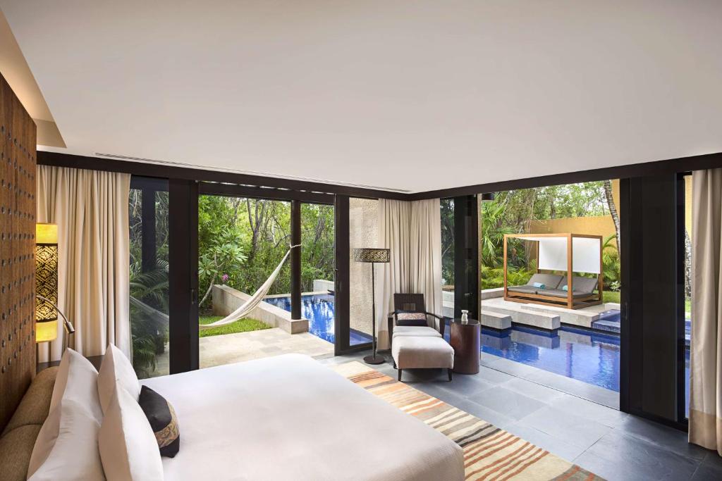 Postel nebo postele na pokoji v ubytování Banyan Tree Mayakoba