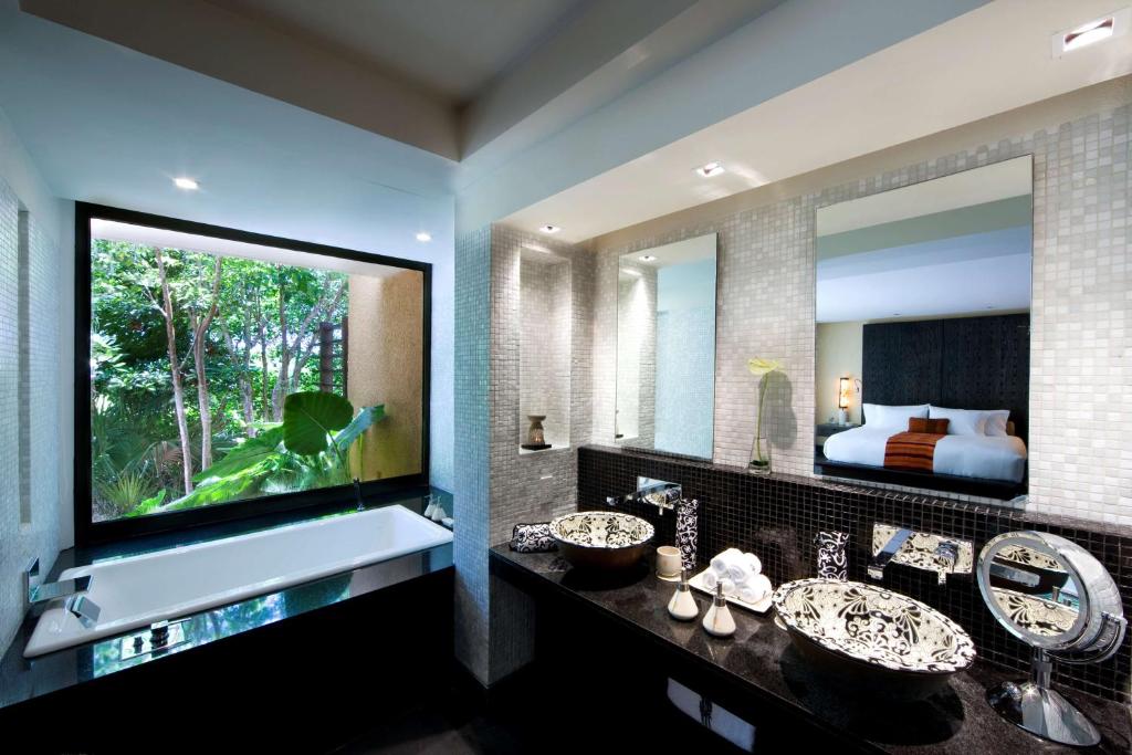 TV a/nebo společenská místnost v ubytování Banyan Tree Mayakoba