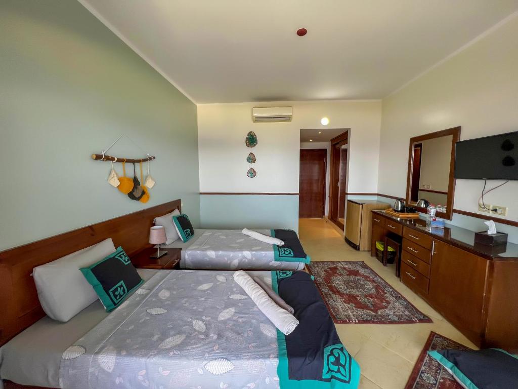 Postel nebo postele na pokoji v ubytování Club Red Dahab Motel