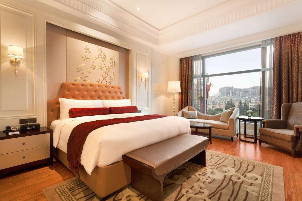 Postel nebo postele na pokoji v ubytování Wyndham Grand Xi'an Residence