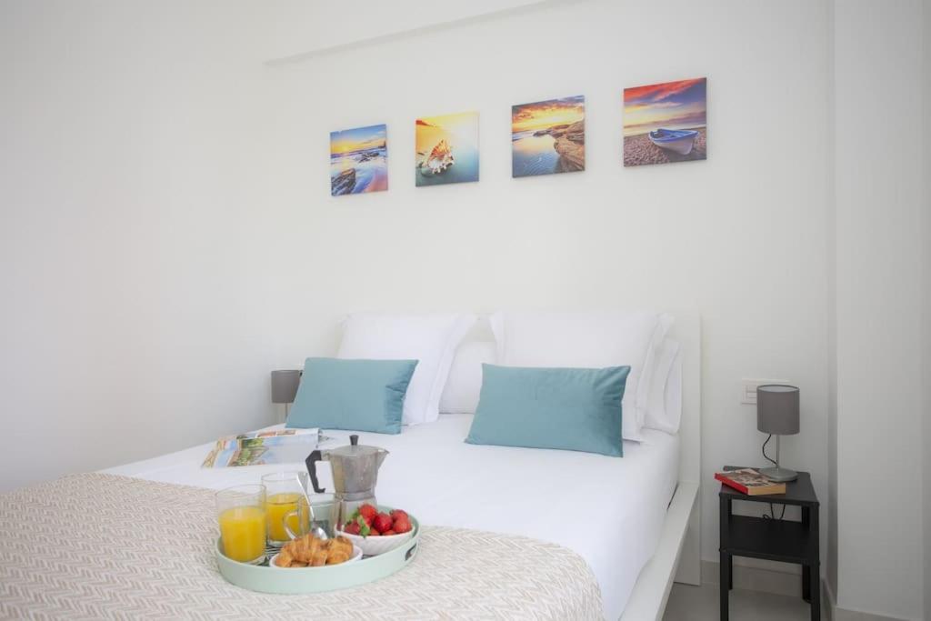 Postel nebo postele na pokoji v ubytování SingularStays Cullera V