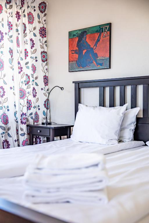 Postel nebo postele na pokoji v ubytování Saga Hotell