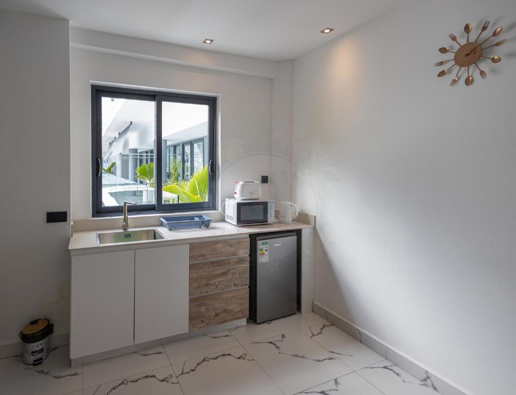Kuchyň nebo kuchyňský kout v ubytování O'Beach Boutique Studios