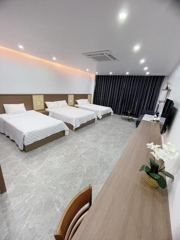 Postel nebo postele na pokoji v ubytování Mai An Hotel