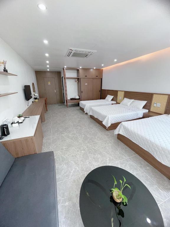 Postel nebo postele na pokoji v ubytování Mai An Hotel