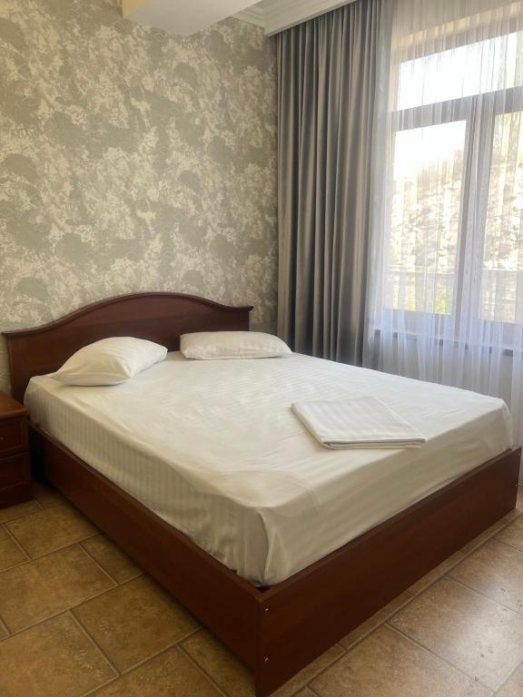 Postel nebo postele na pokoji v ubytování Park Avenue Hotel Yerevan