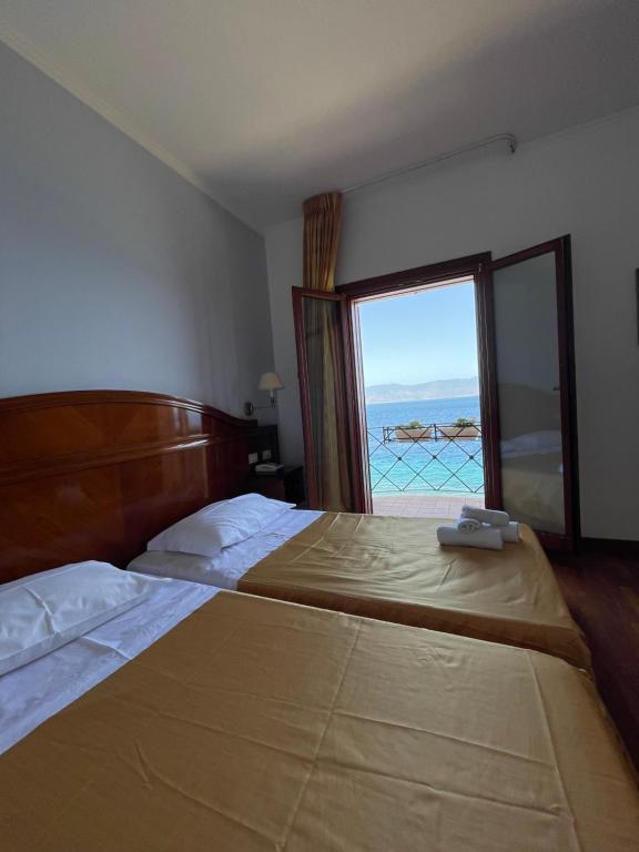 Postel nebo postele na pokoji v ubytování Hotel La Lampara
