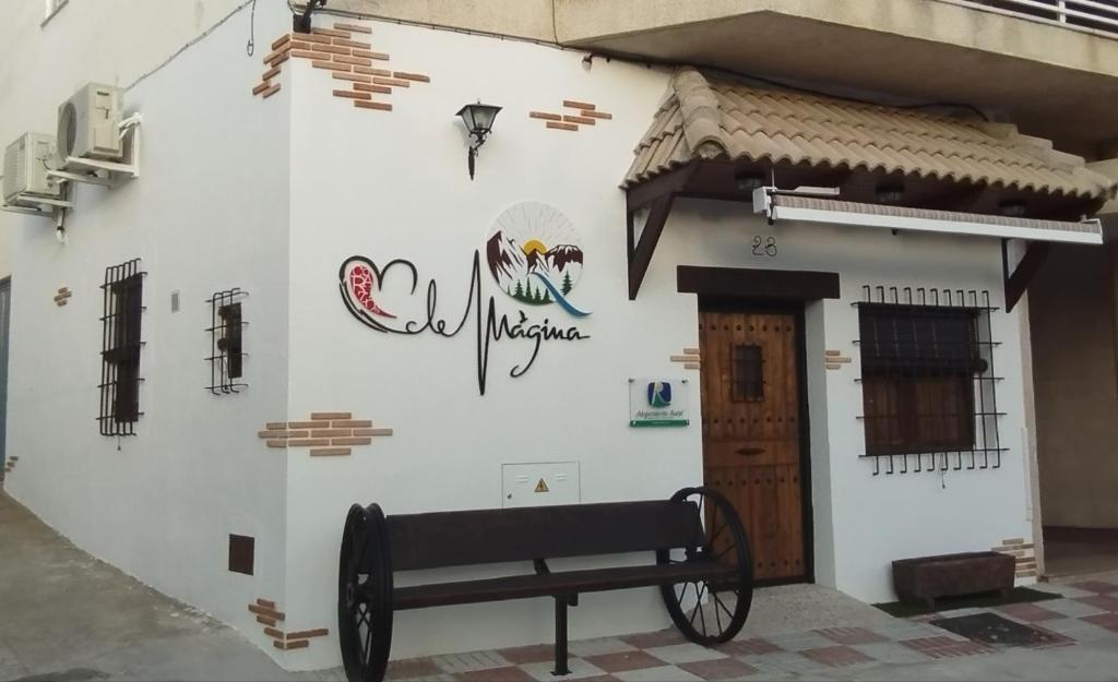 a building with a bench in front of it at Corazón de Mágina in Bedmar
